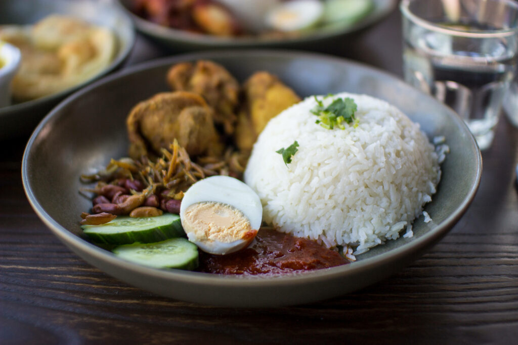 Elegant Nasi Lemak Plate in Cozy Perth Setting - Wallpaper Background