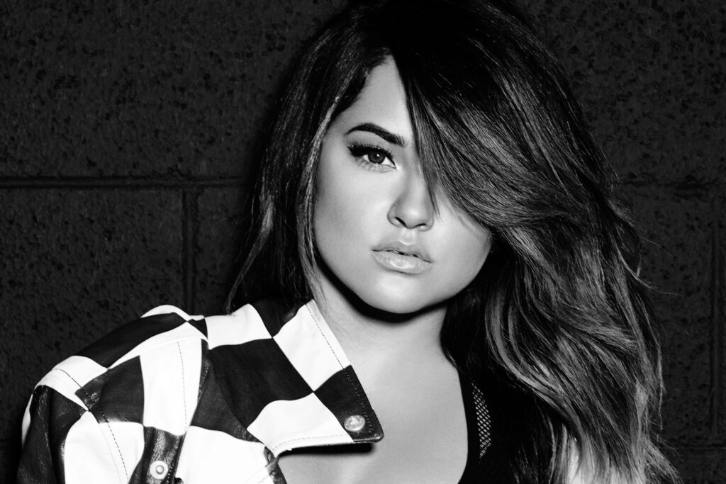 Becky G monochrome wallpaper confident expression stylish hair textured dark background