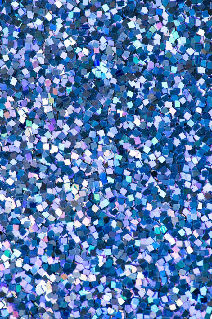 Sparkling Blue Serenity: A stunning photo capturing a bed of shimmering blue glitters, creating a simple yet captivating blue aesthetic background. Wallpaper
