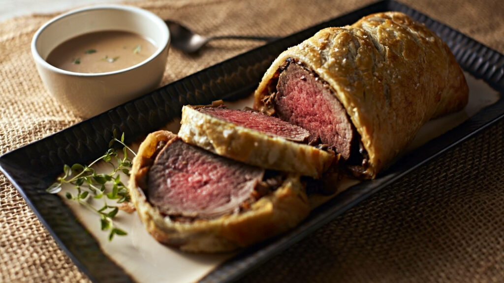 Delicious Beef Wellington Wallpaper: Fine Dining Culinary Experience