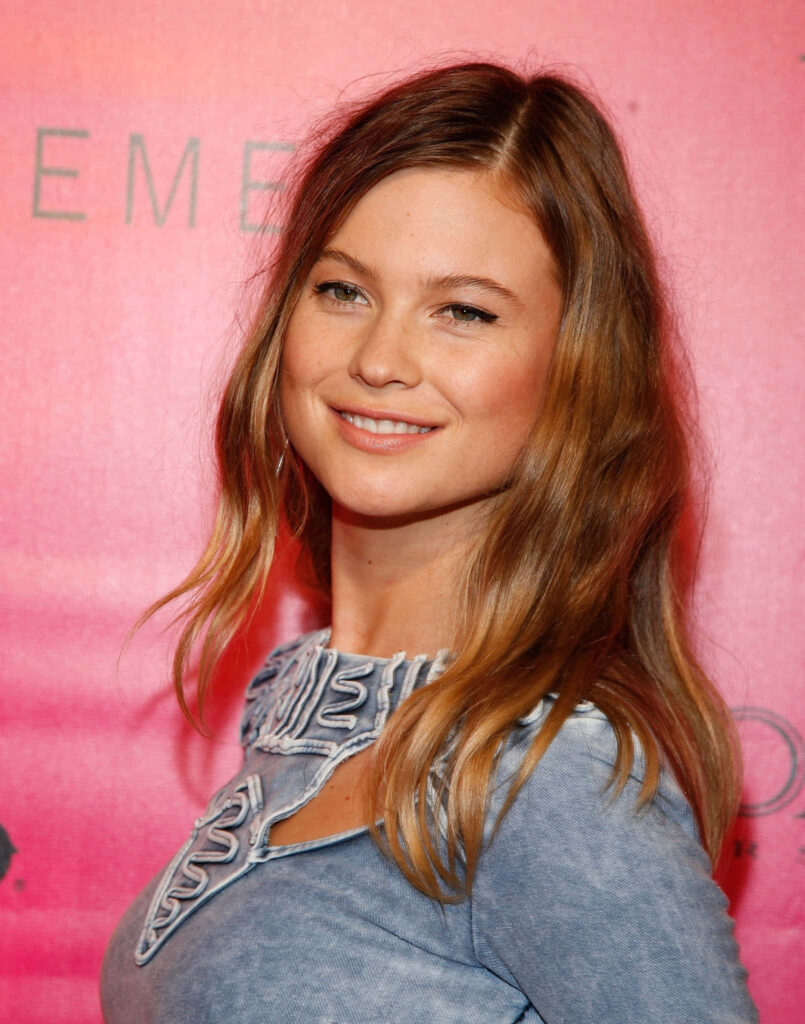 Behati Prinsloo smiling warmly against soft pink background stylish cheerful wallpaper