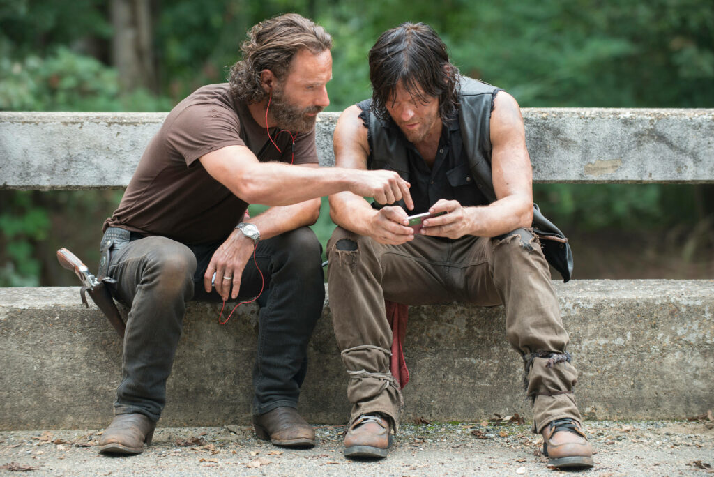 Behind the Scenes of The Walking Dead: Actors in Character Outdoors Wallpaper