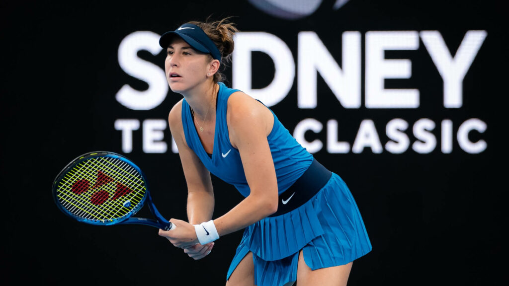Belinda Bencic intense tennis serve return showcasing athleticism and determination wallpaper