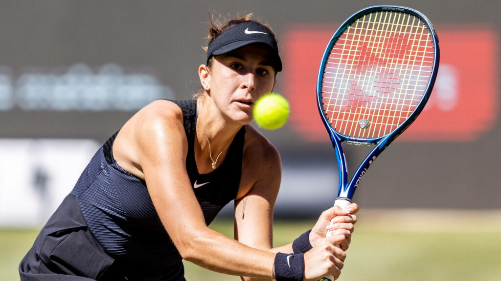Belinda Bencic intense tennis return action showing athleticism in professional match wallpaper