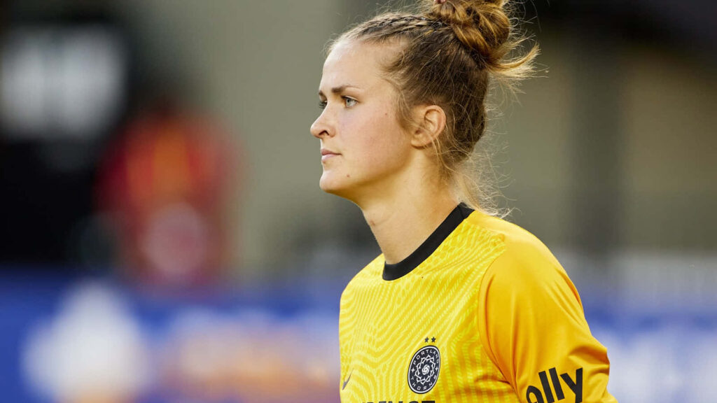 Bella Bixby goalkeeper focused in jersey showing determination on soccer field dynamic wallpaper