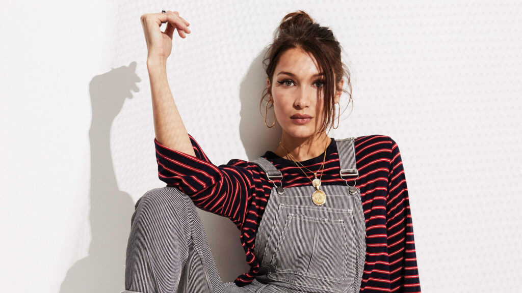 Bella Hadid's Casual Style: Striped Top & Overalls Wallpaper