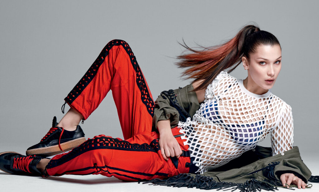 Stunning Bella Hadid Wallpaper: Confident Model in Stylish Outfit