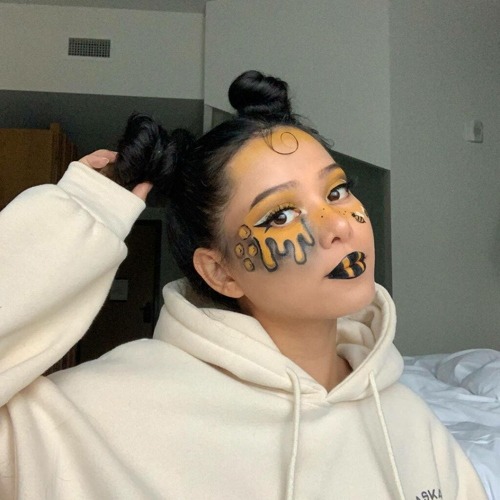 Bee-Inspired Face Makeup Wallpaper featuring Bella Poarch