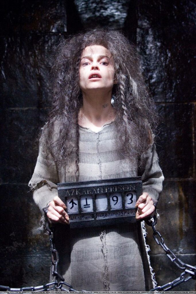 Bellatrix Lestrange imprisoned in Azkaban wearing tattered clothes holding prison number Wallpaper