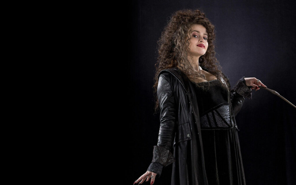 Bellatrix Lestrange confident pose wand dark gothic attire dramatic black background wallpaper