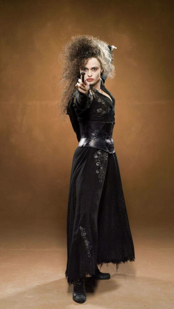 Bellatrix Lestrange in dark detailed outfit with wild hair casting spell wand on brown background Wallpaper