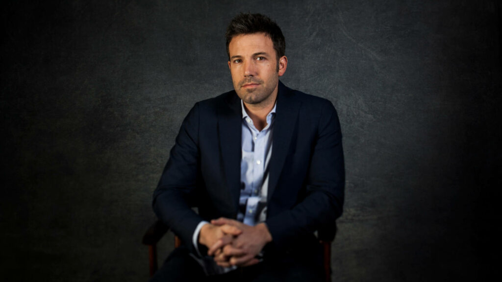 Ben Affleck Wallpaper: Navy Suit Elegance Against Dark Texture