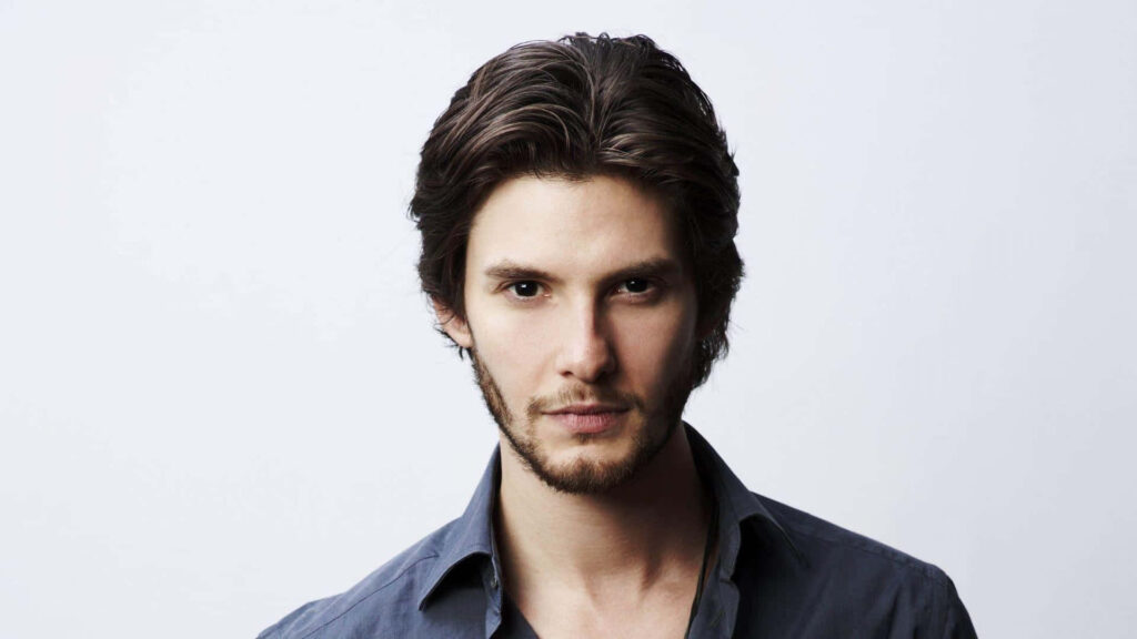 High resolution portrait of British actor Ben Barnes with confident expression on light background Wallpaper