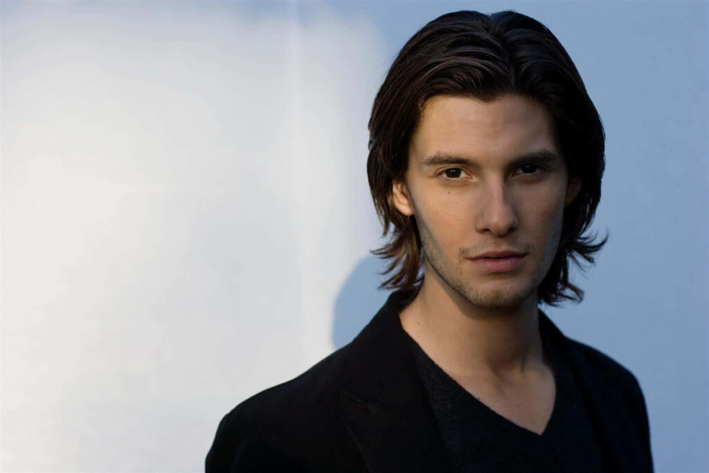 Ben Barnes portrait wallpaper with sharp features and confident gaze on light background