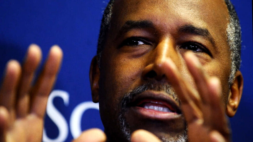 Ben Carson thoughtful discussion professional backdrop renowned neurosurgeon politician wallpaper