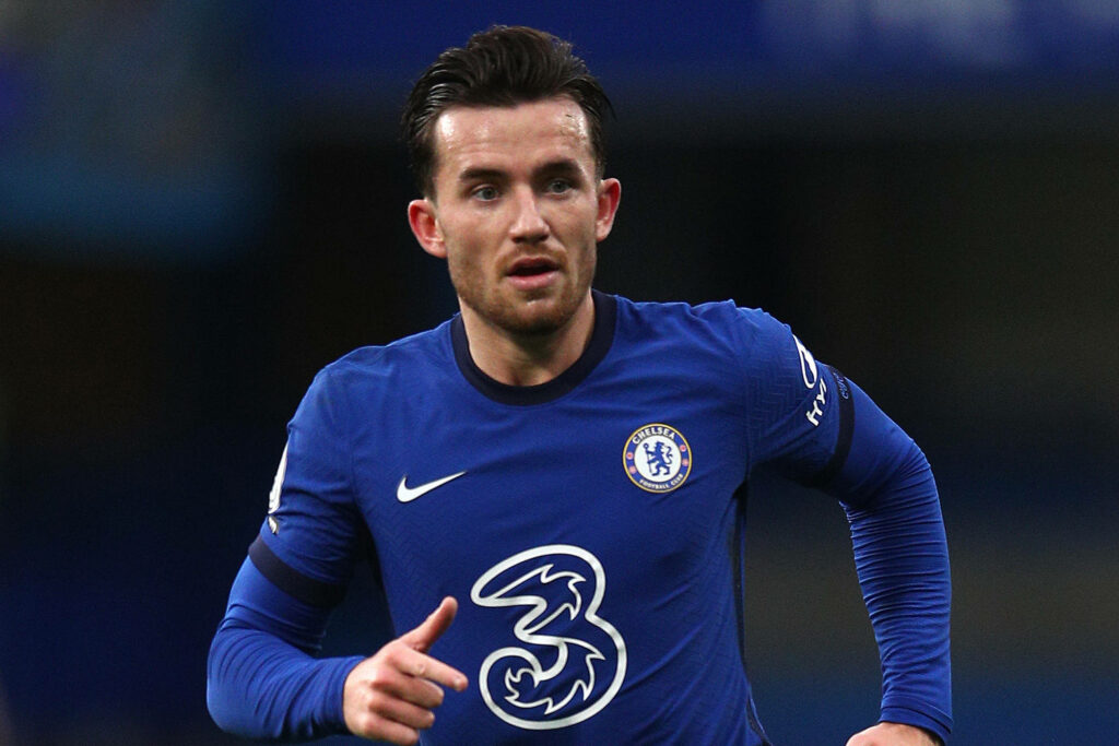 Ben Chilwell Chelsea kit action shot running on field showing focus and athleticism wallpaper