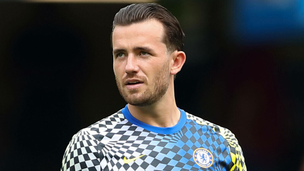 Ben Chilwell in modern checkered Chelsea football shirt confident pose wallpaper background
