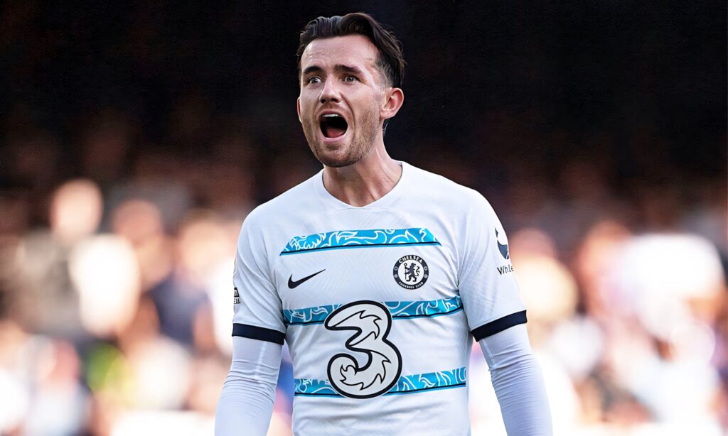 Ben Chilwell shouting passionately in Chelsea FC white jersey during an intense football match Wallpaper