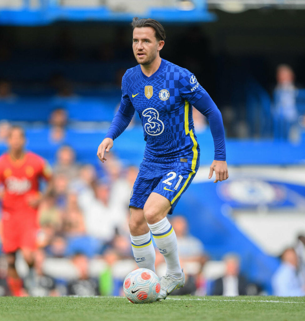 Ben Chilwell focused in Chelsea kit on pitch ready to make a play dynamic football wallpaper
