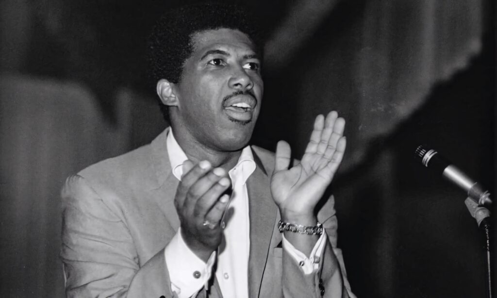 Ben E King soulful stage performance wallpaper capturing iconic singer in powerful expression