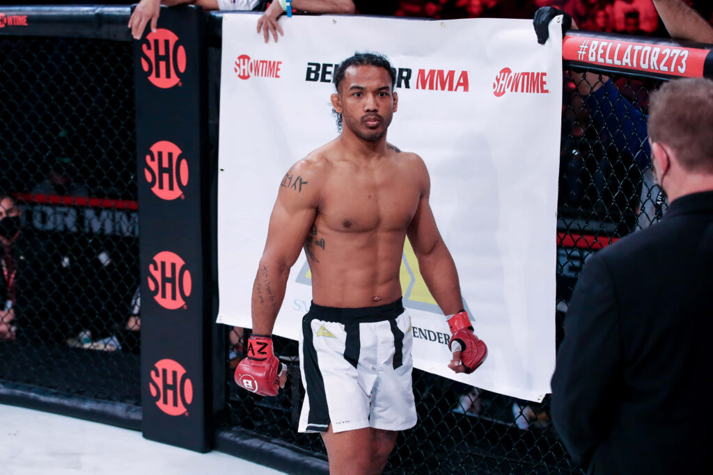 Ben Henderson focused in Bellator MMA ring showing athletic build and intense determination Wallpaper