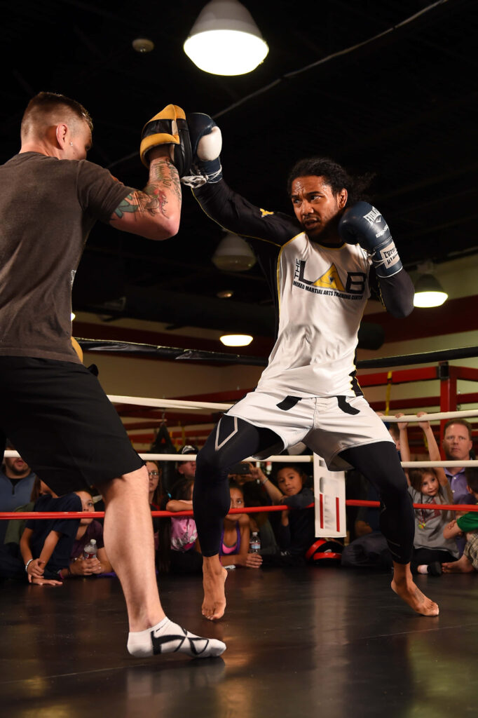 Ben Henderson MMA fighter intense training focused sparring in ring athletic determination wallpaper