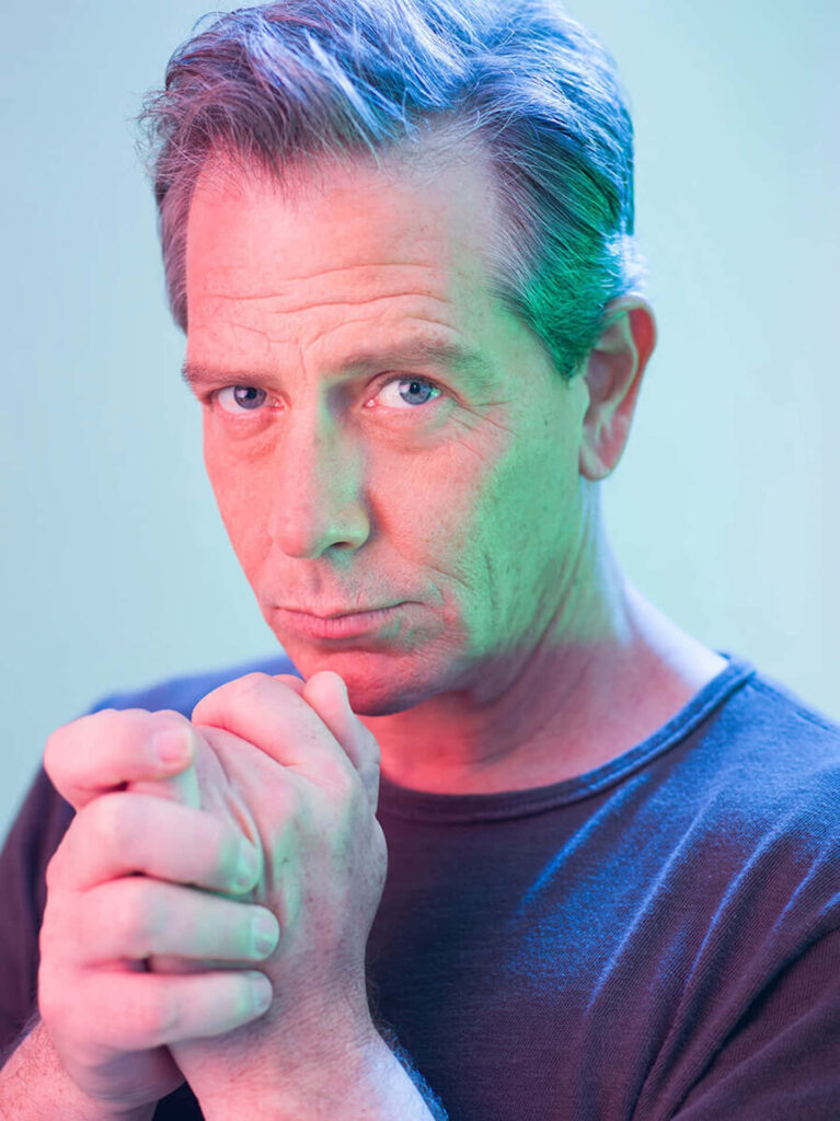 Ben Mendelsohn intense gaze vivid portrait bright lighting confident expressive eyes wallpaper