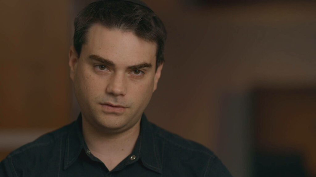Portrait of Ben Shapiro political commentator on American left wing critique blurred background Wallpaper