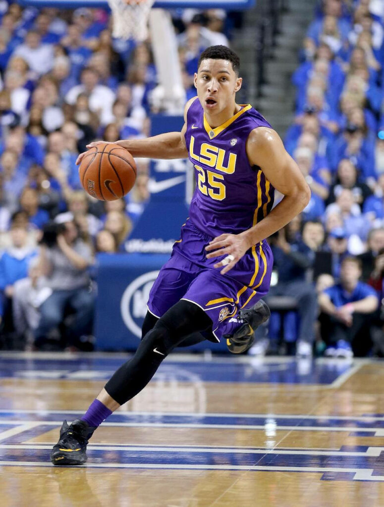 Ben Simmons dribbling basketball court in LSU uniform during intense game action wallpaper