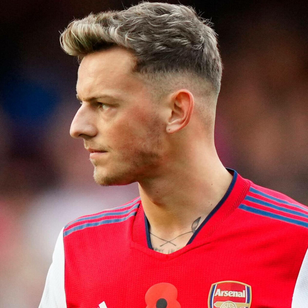 Ben White Arsenal kit side profile focused expression detailed hairstyle wallpaper background