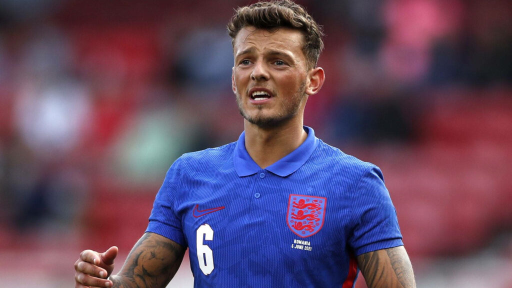 Ben White in England football kit focused on field showcasing defensive skills wallpaper background
