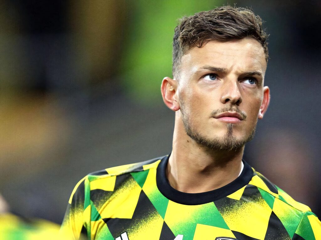 Close-up of Ben White intense expression wearing vibrant geometric jersey dynamic wallpaper background