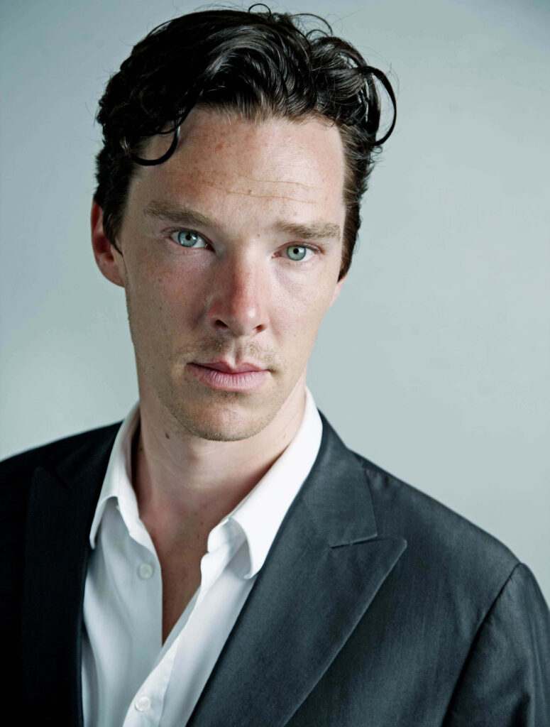 Benedict Cumberbatch intense gaze in white shirt and dark suit on soft neutral background wallpaper