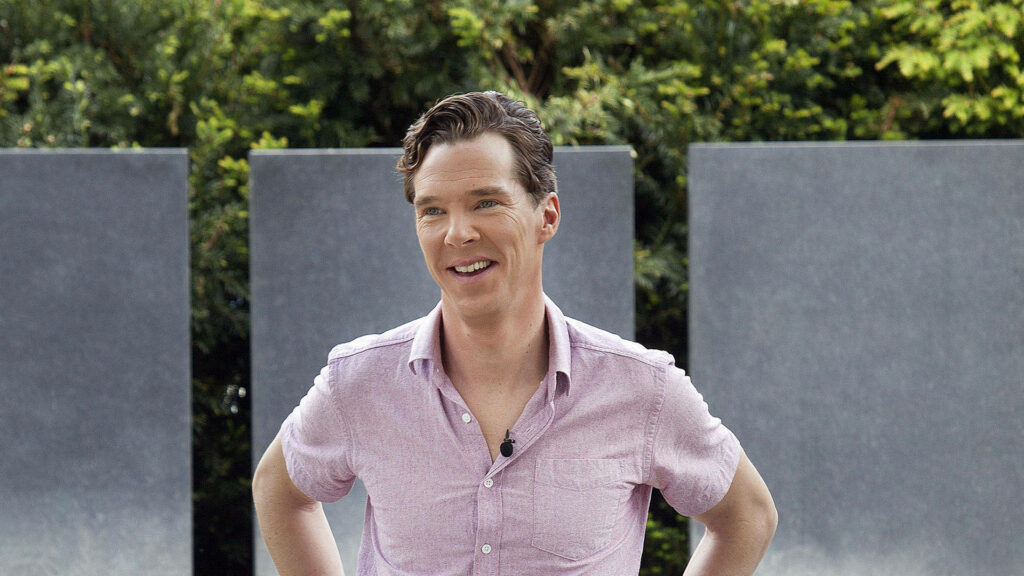 Benedict Cumberbatch laughing outdoors in light pink shirt with green nature background wallpaper