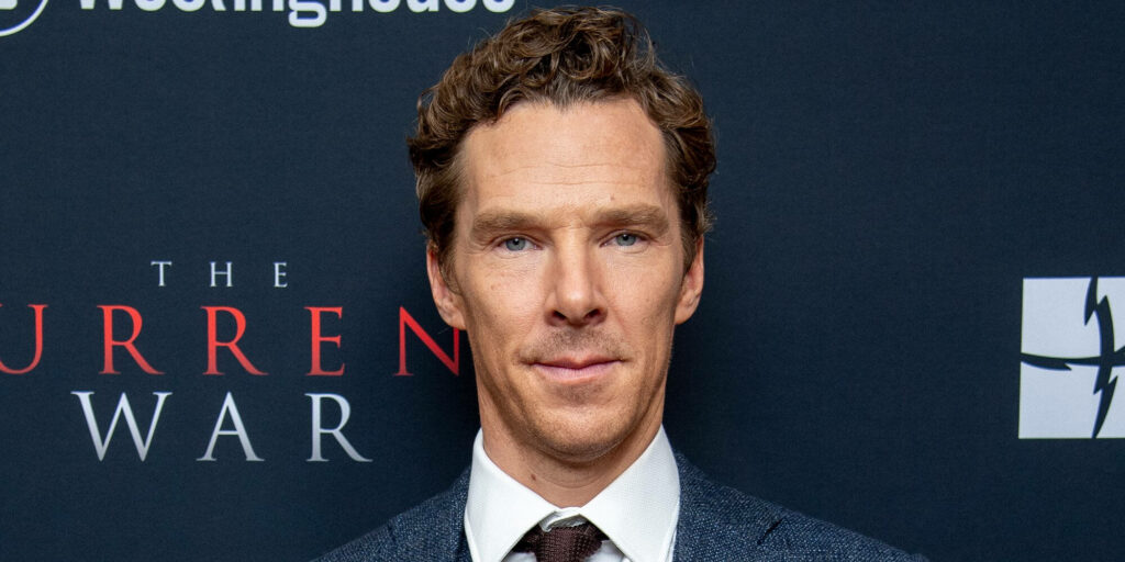Benedict Cumberbatch in formal suit posing at The Current War movie backdrop wallpaper background