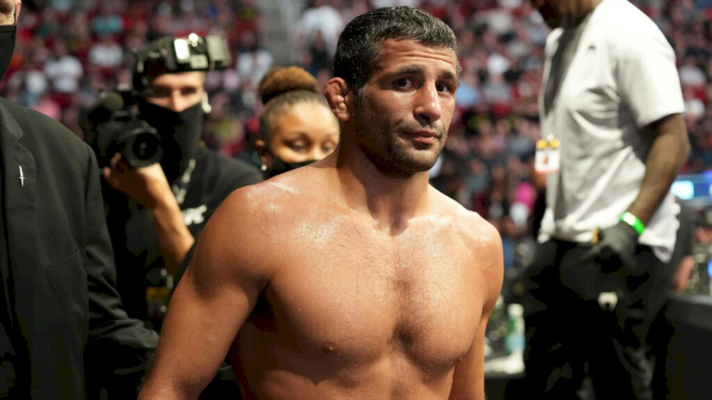 Beneil Dariush focused in arena preparing for UFC fight with energetic crowd background wallpaper