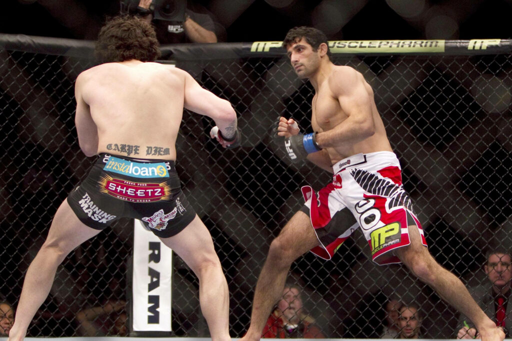 Beneil Dariush intense MMA octagon action ready to fight opponent thrilling mixed martial arts Wallpaper