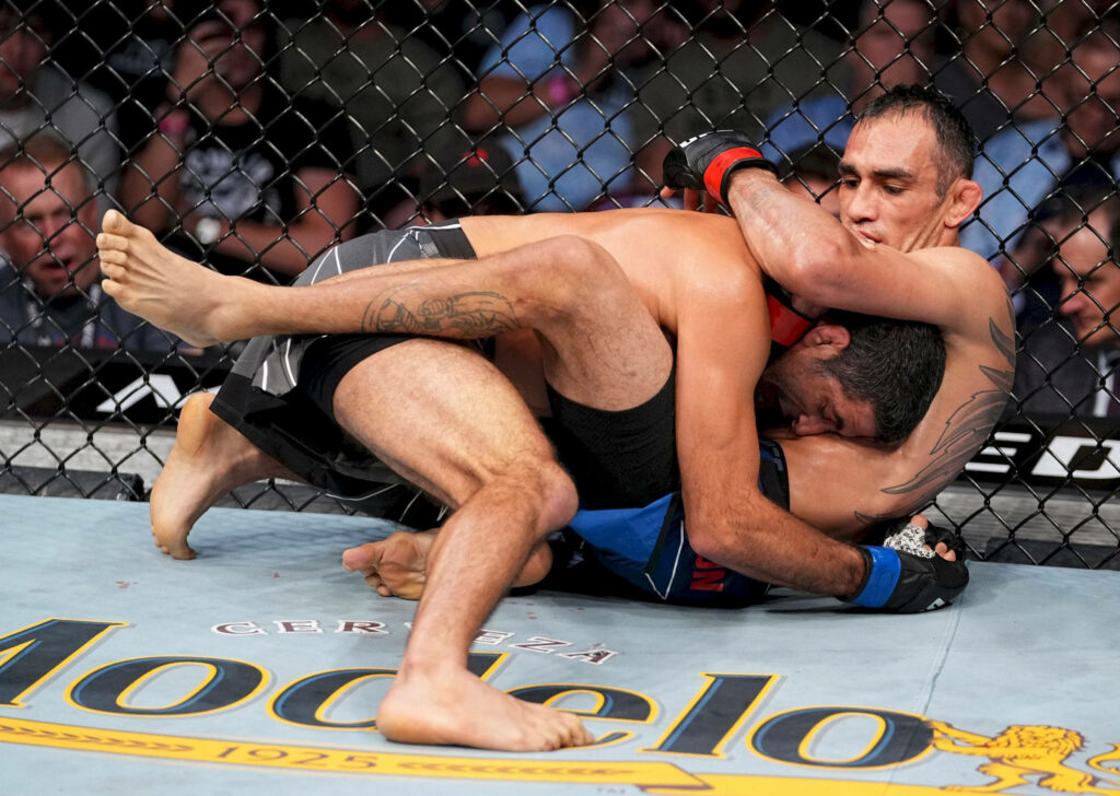 Beneil Dariush grappling opponent in UFC fight intense octagon action wallpaper background