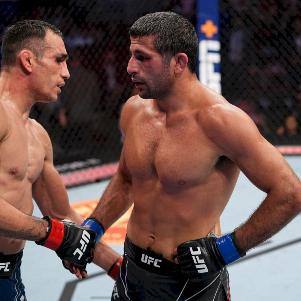 Beneil Dariush shaking hands with opponent inside UFC octagon showing sportsmanship and respect Wallpaper