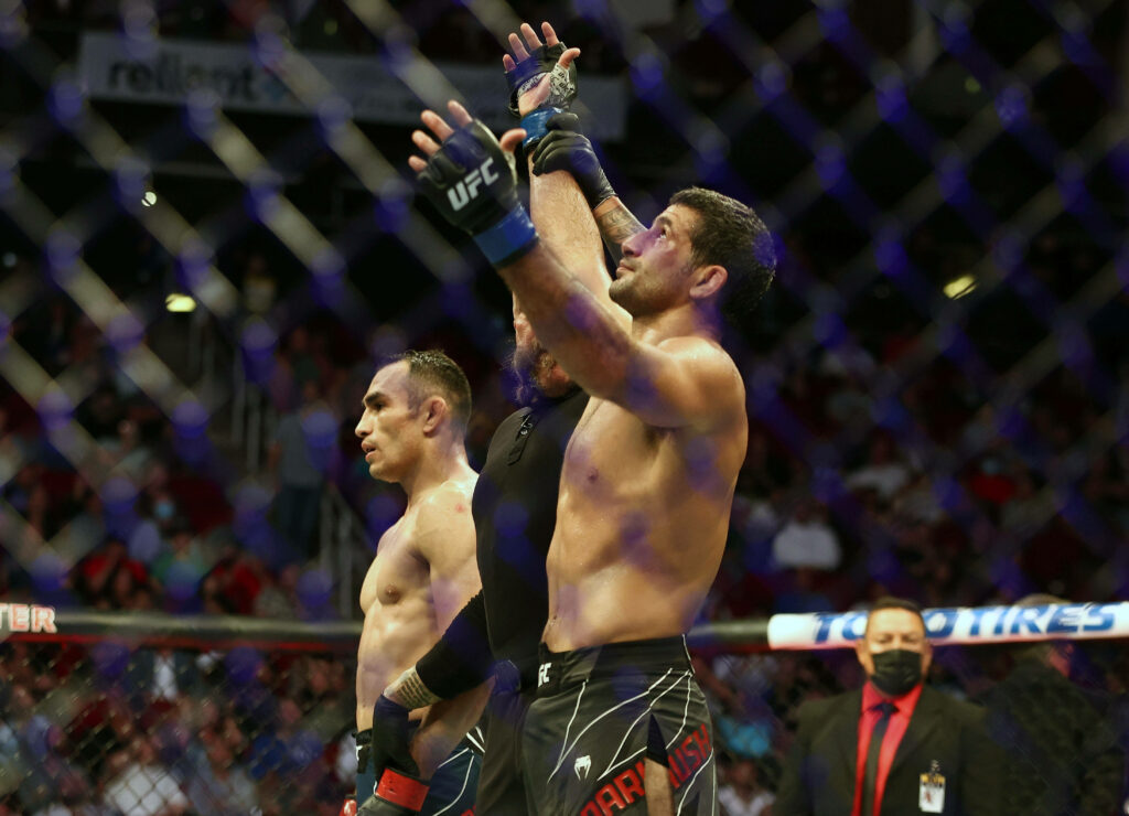 Beneil Dariush UFC victory celebration inside octagon with cheering crowd background wallpaper