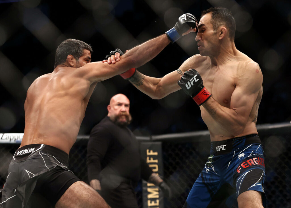 Beneil Dariush and Tony Ferguson UFC fight intense octagon strike exchange wallpaper background