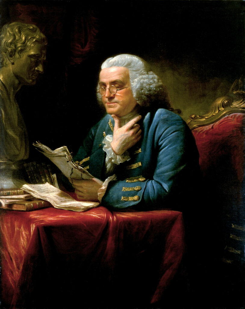 Benjamin Franklin portrait wallpaper with symbols of knowledge innovation and thoughtful reading background
