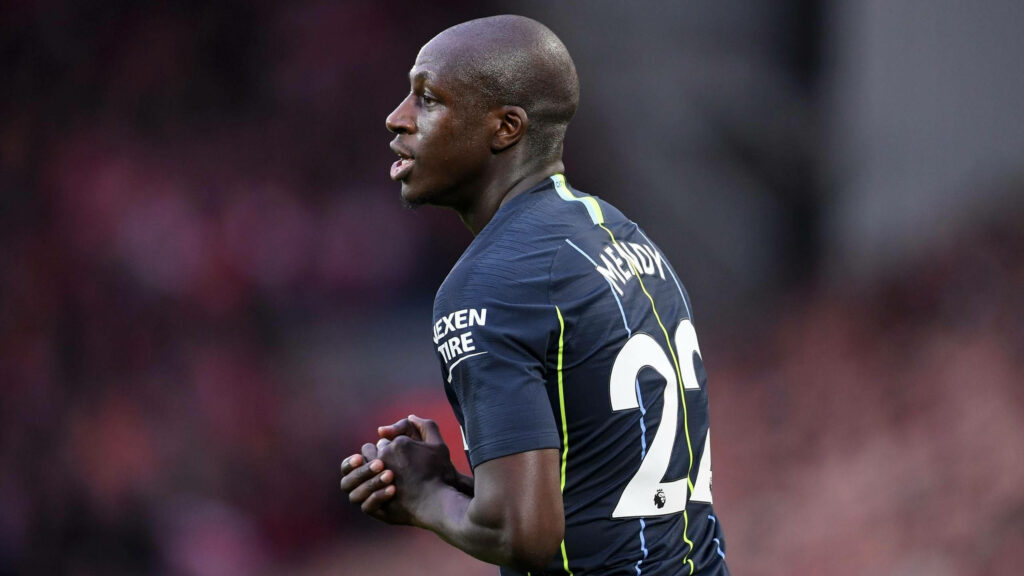 Benjamin Mendy in dark blue jersey number on back playing football match action wallpaper background