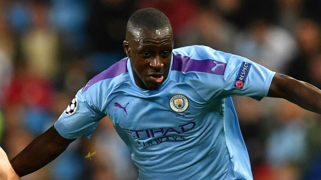 Benjamin Mendy focused in Manchester City kit during match showcasing intense football gameplay energy Wallpaper