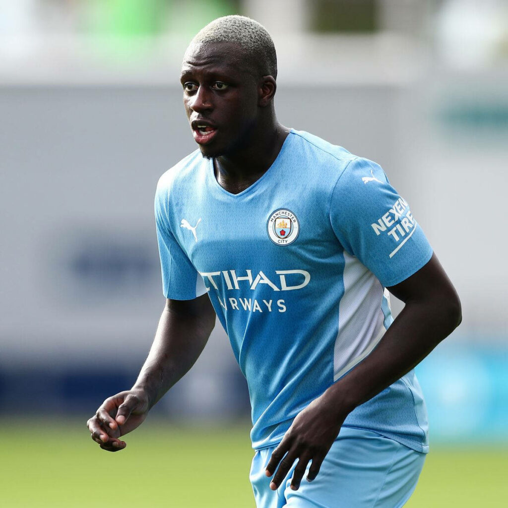 Benjamin Mendy side view in Manchester City kit action wallpaper background football player