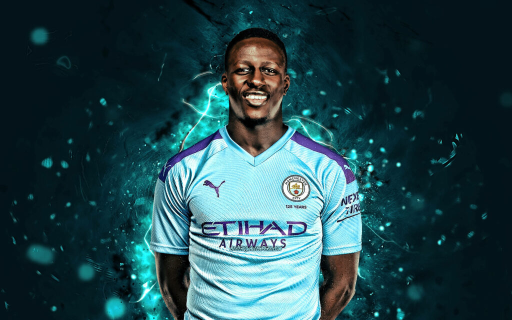 Benjamin Mendy in Manchester City kit with electric blue purple effects and bold Puma logo wallpaper