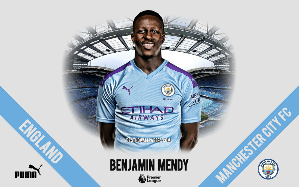 Benjamin Mendy in Manchester City kit standing confidently at Etihad Stadium Premier League wallpaper
