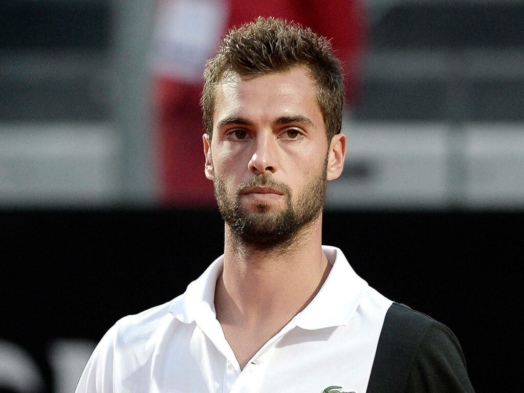Close-up of Benoît Paire serious focused expression athletic presence tennis wallpaper background