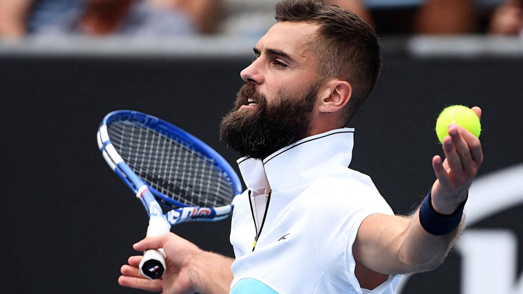 Benoît Paire confident on tennis court holding racket and ball dynamic sports wallpaper background