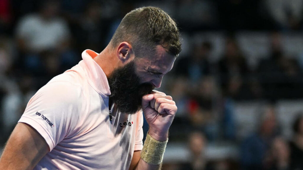 Benoît Paire intense tennis celebration with determined fist pump on court wallpaper background